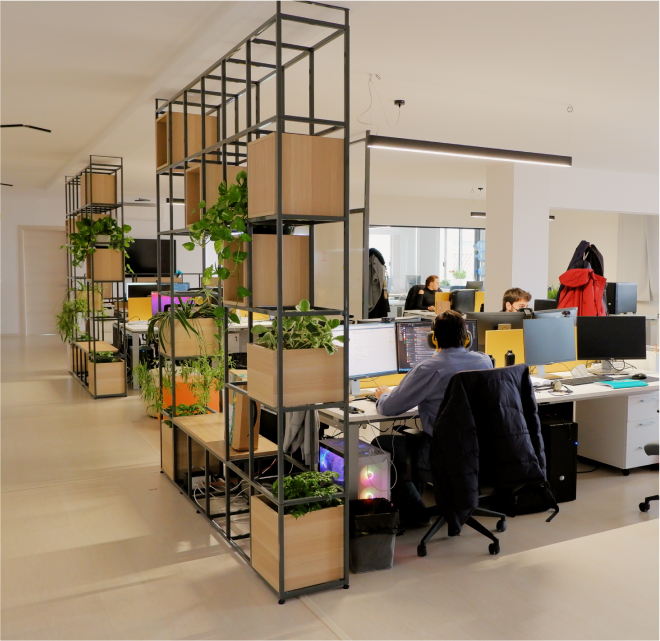 ZURU office floor, multiple desks with employees working